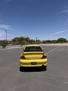 Yellow 2003 Mitsubishi Lancer Evolution Base