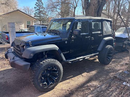 Black 2015 Jeep Wrangler Unlimited Sport