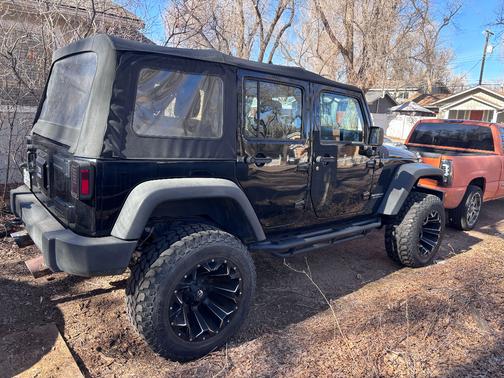 Black 2015 Jeep Wrangler Unlimited Sport