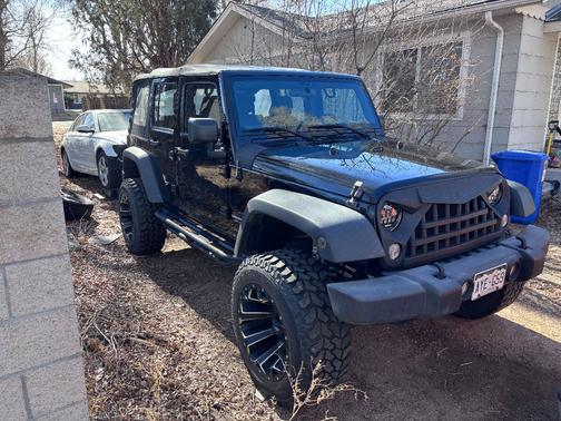 Black 2015 Jeep Wrangler Unlimited Sport