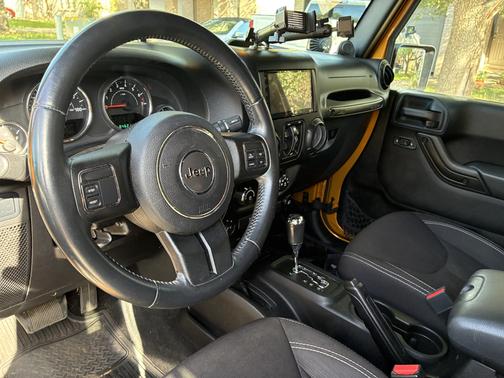 Yellow 2014 Jeep Wrangler Unlimited Rubicon