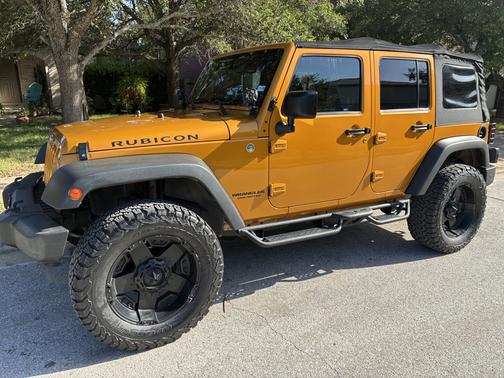 Yellow 2014 Jeep Wrangler Unlimited Rubicon