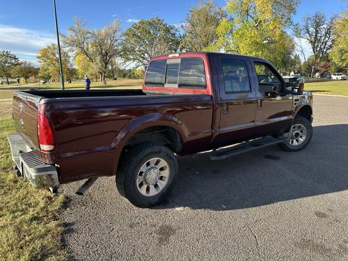 Red 2010 Ford F-250 Lariat Super Duty Crew Cab