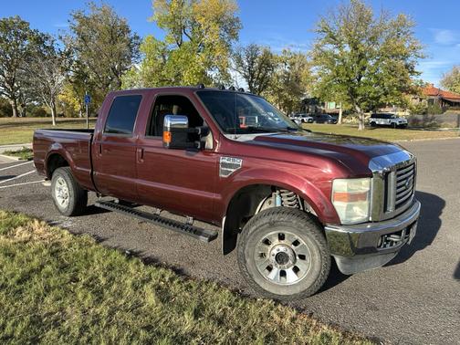Red 2010 Ford F-250 Lariat Super Duty Crew Cab