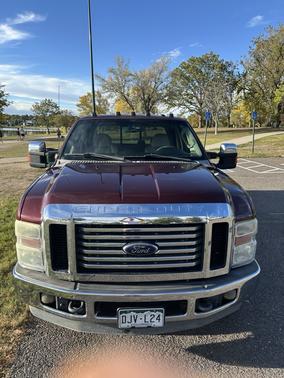 Red 2010 Ford F-250 Lariat Super Duty Crew Cab