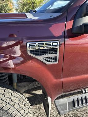 Red 2010 Ford F-250 Lariat Super Duty Crew Cab