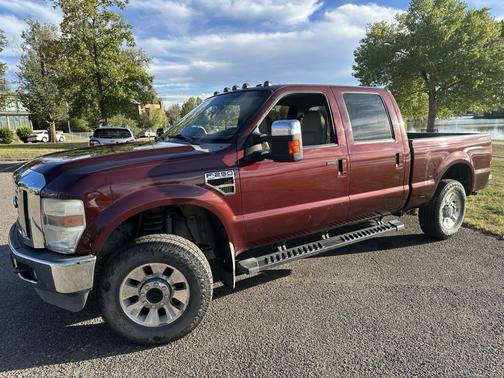 Red 2010 Ford F-250 Lariat Super Duty Crew Cab