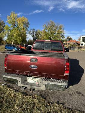 Red 2010 Ford F-250 Lariat Super Duty Crew Cab