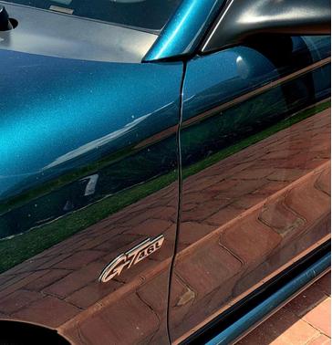 Green 1997 Ford Mustang GT