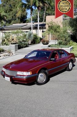 Red 1992 Cadillac Seville STS