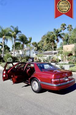Red 1992 Cadillac Seville STS