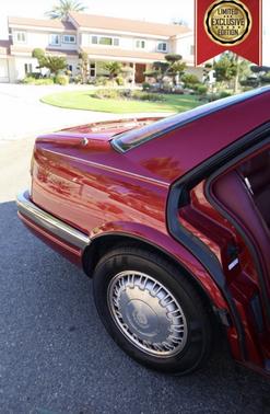 Red 1992 Cadillac Seville STS