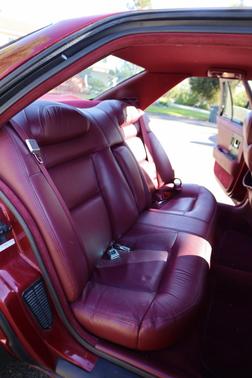 Red 1992 Cadillac Seville STS