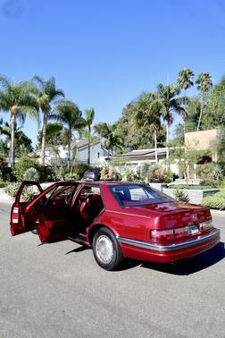 Red 1992 Cadillac Seville STS
