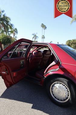 Red 1992 Cadillac Seville STS