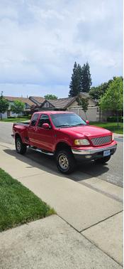 Red 2001 Ford F-150 XL SuperCab Flareside