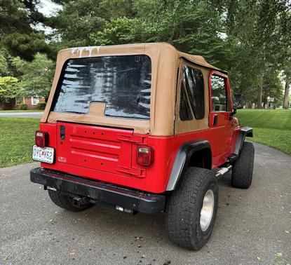Red 1999 Jeep Wrangler Sport