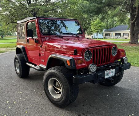 Red 1999 Jeep Wrangler Sport