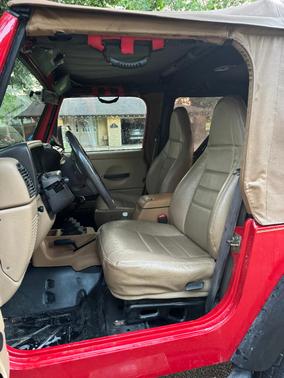Red 1999 Jeep Wrangler Sport