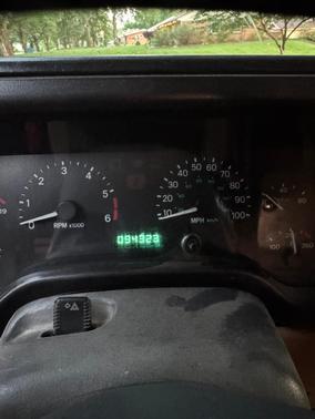 Red 1999 Jeep Wrangler Sport