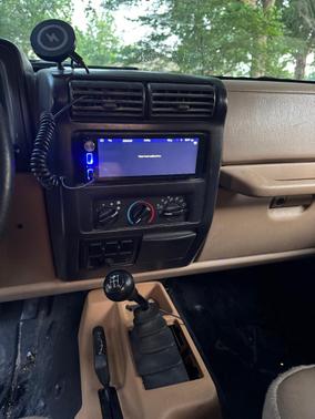 Red 1999 Jeep Wrangler Sport