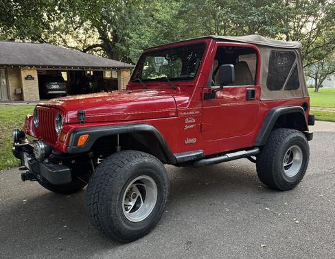 Red 1999 Jeep Wrangler Sport