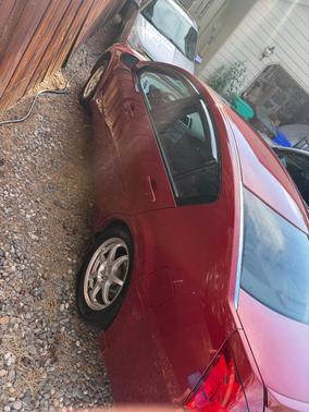 Red 2005 Nissan Maxima SE
