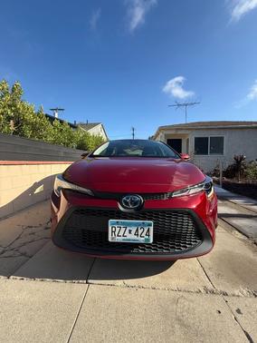 Red 2022 Toyota Corolla Hybrid LE