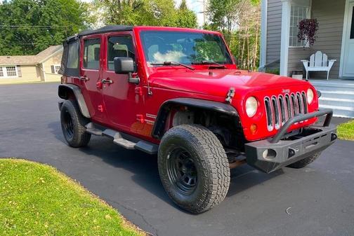 Red 2010 Jeep Wrangler Unlimited Sport