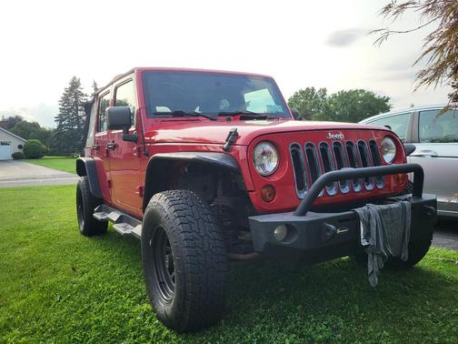 Red 2010 Jeep Wrangler Unlimited Sport