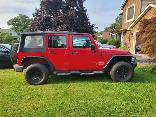 Red 2010 Jeep Wrangler Unlimited Sport