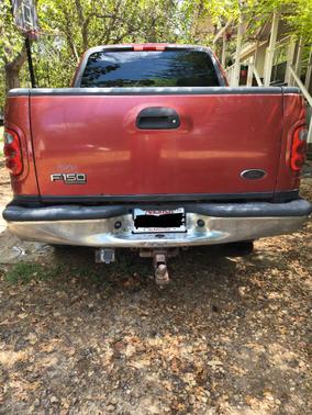 Red 2002 Ford F-150 Lariat SuperCrew