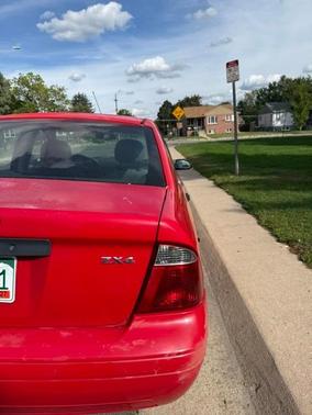 Red 2006 Ford Focus ZX4 SE