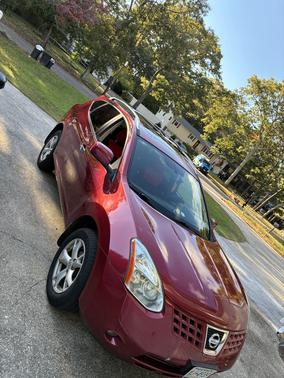 Red 2010 Nissan Rogue SL