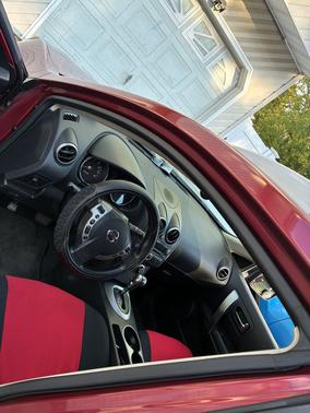 Red 2010 Nissan Rogue SL