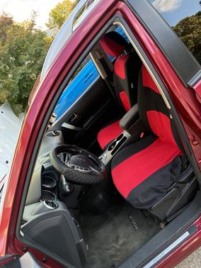 Red 2010 Nissan Rogue SL