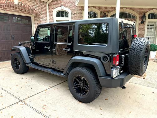 Black 2015 Jeep Wrangler Unlimited Sport