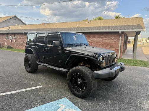 Black 2012 Jeep Wrangler Unlimited Altitude