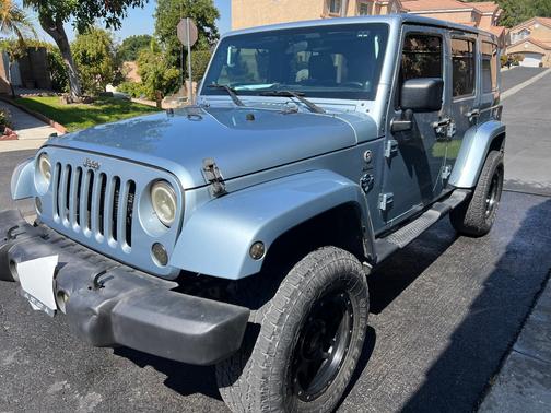 Blue 2012 Jeep Wrangler Unlimited Sport RHD