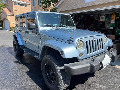 Blue 2012 Jeep Wrangler Unlimited Sport RHD