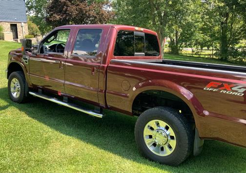 Red 2010 Ford F-350 Lariat Super Duty Crew Cab