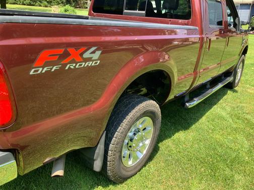 Red 2010 Ford F-350 Lariat Super Duty Crew Cab