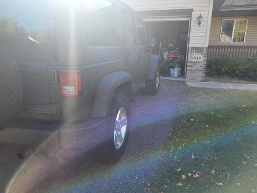 Black 2014 Jeep Wrangler Unlimited Sport
