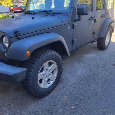 Black 2014 Jeep Wrangler Unlimited Sport