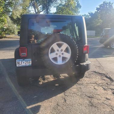 Black 2014 Jeep Wrangler Unlimited Sport