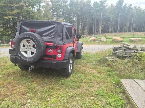 Red 2010 Jeep Wrangler Sport