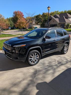 Black 2014 Jeep Cherokee Sport