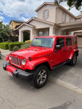 Red 2016 Jeep Wrangler Unlimited Sahara