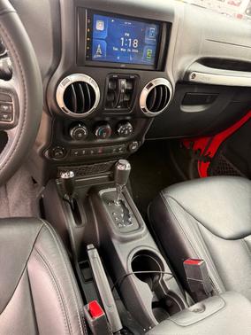 Red 2016 Jeep Wrangler Unlimited Sahara
