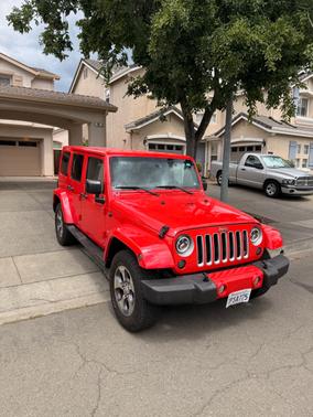 Red 2016 Jeep Wrangler Unlimited Sahara